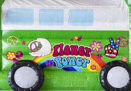 Pedir castillo hinchable estándar con techo en tema hippy verde para niños