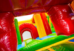 Interior del castillo inflable Dubbelslide Multiplay Verde rojo amarillo