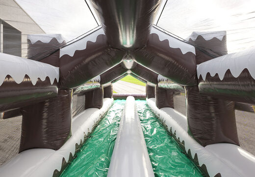 Consigue un tobogán doble hinchable con tema invernal para jóvenes y mayores. Compra ahora online atracciones hinchables de invierno en JB Hinchables España