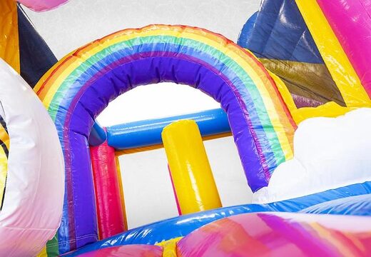 Cojín de aire hinchable en tema unicornio para niños con tobogán y compra objetos en él