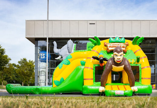 Pide multi super hinchable con tobogán en tema Jungle verde amarillo para niños